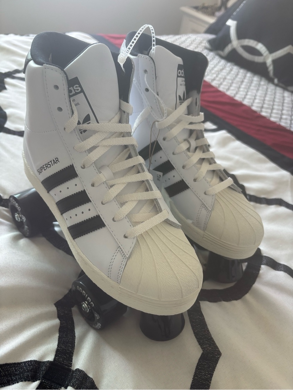 adidas White and Black High-Top Roller Skate Sneakers